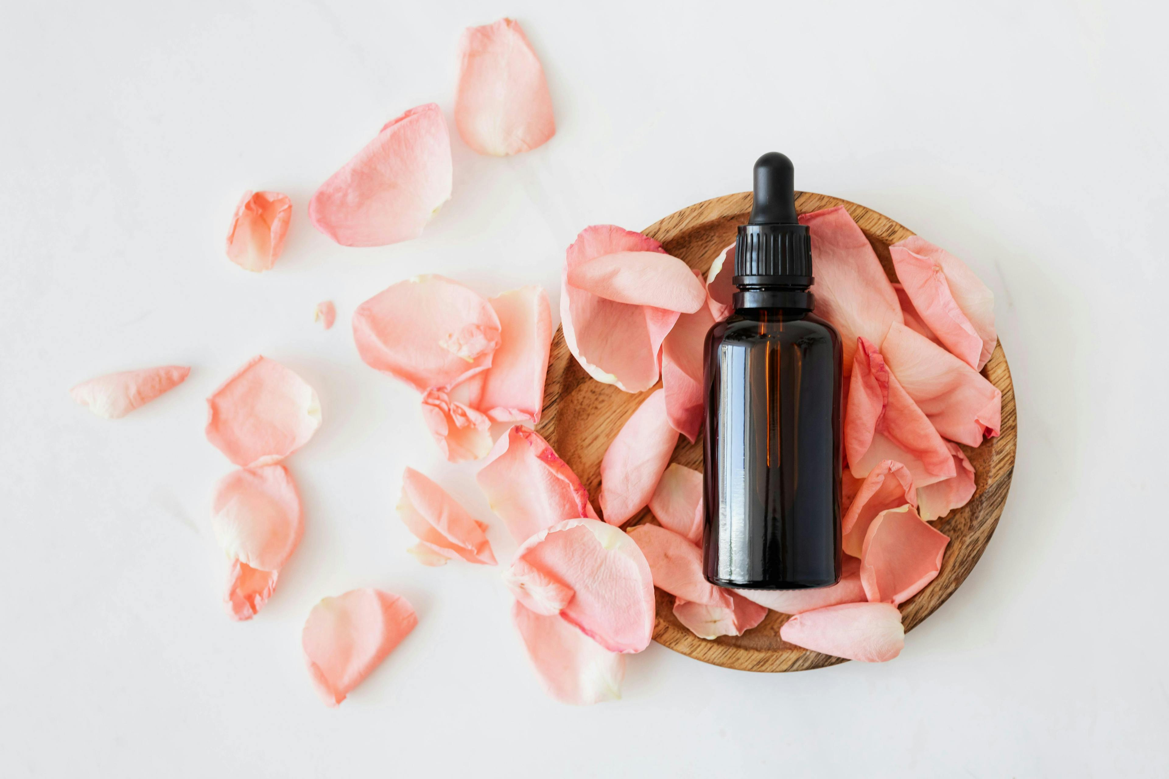 A jar of 21 Royalties Breast Cream next to soothing natural ingredients